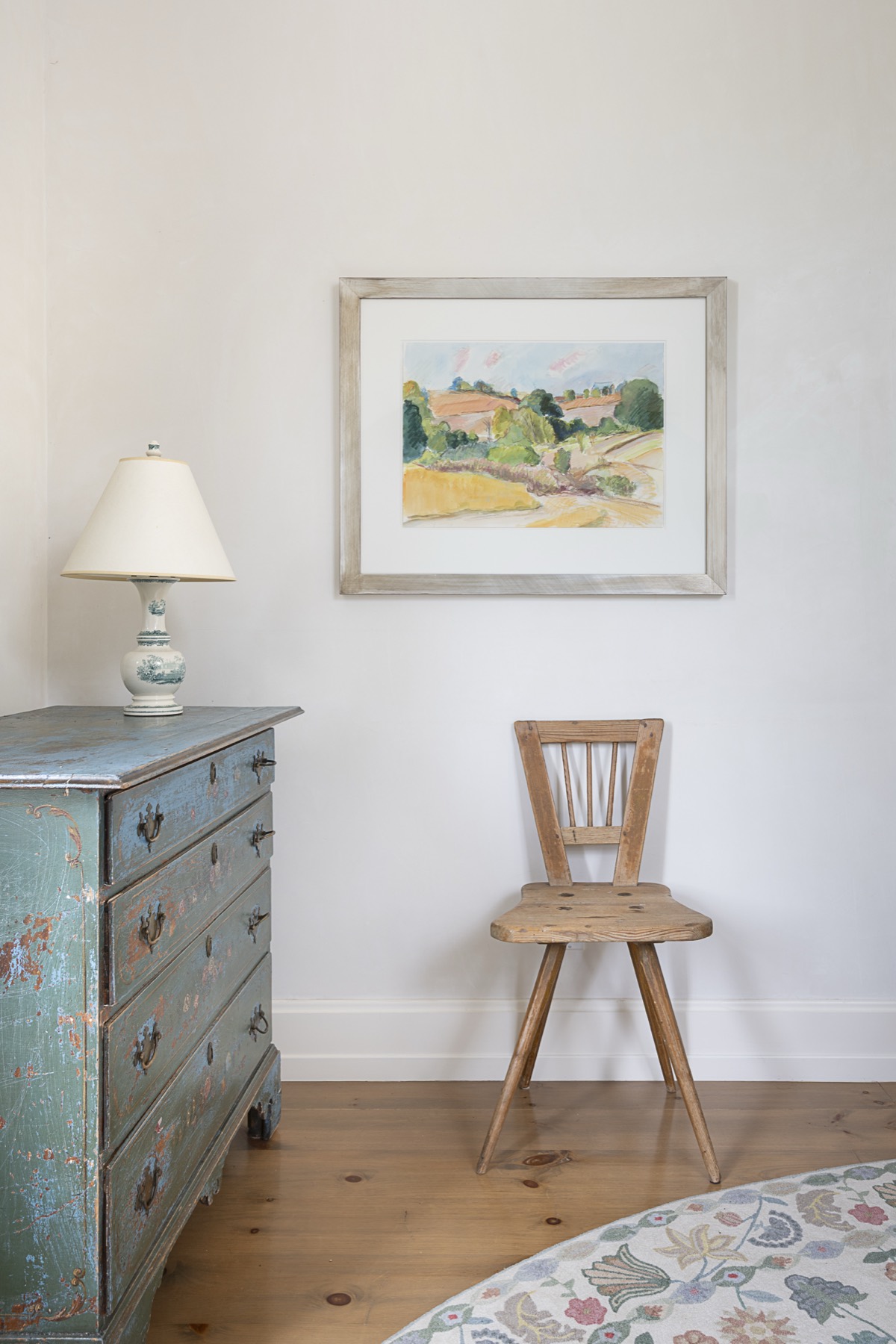 Watercolor farm landscape above a weathered blue painted dresser